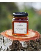 Glas med Hédéne  Havtorn honning,  Bourdaine de Gironde,  på træstub,  Frankrig