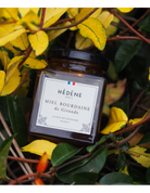 Glas med Hédéne  Havtorn honning,  Bourdaine de Gironde,  mellem grene,  Frankrig