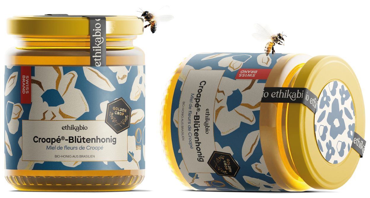 To glas med Ethikabio blomsterhonning, og 2 honningbier, Brasilien